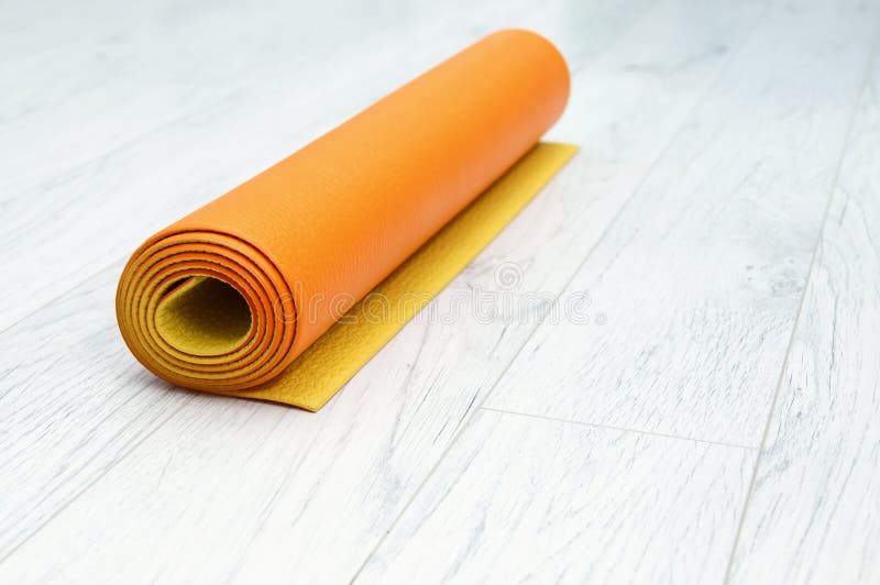 Bright Orange Yoga Mat on a Light Gray Laminate Stock Image Image of