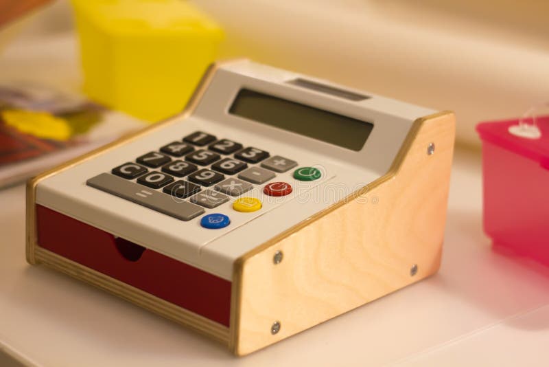 Bright Original Electronic Calculator Horizontally Stands on the Table