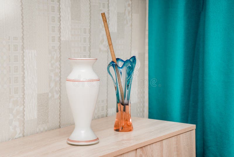The bright photo of a table with the vases stock image