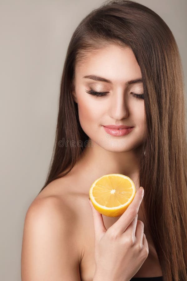 Bright picture of beautiful woman with lemon slice