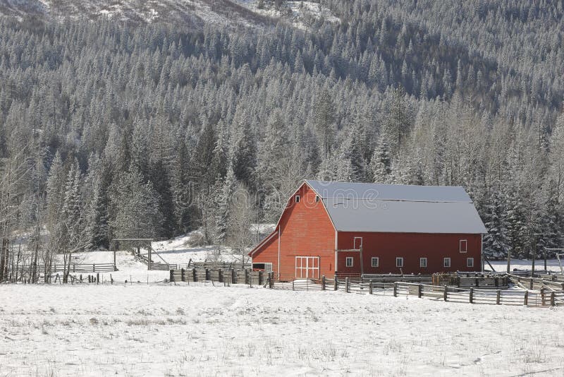 Red barn on the prairie in winter.