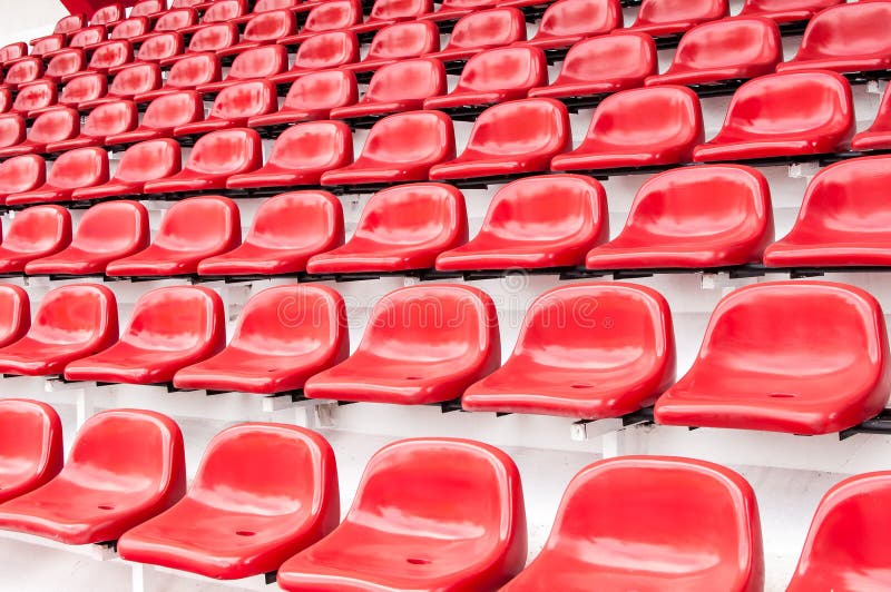 Bright red stadium seats stock image. Image of public - 26471617