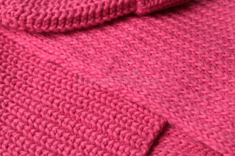 Bright saturated pink background knitted with pattern for design. Textured wool. Abstract backdrop. royalty free stock photo