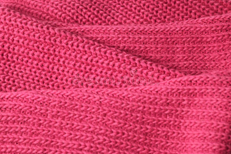 Bright saturated pink background knitted with pattern for design. Textured wool. Abstract backdrop. stock photo