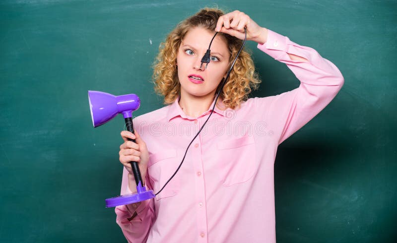 Bright shiny idea. education concept. back to school. enlightenment. idea and inspiration. teacher with lamp at school stock photos Bright shiny idea. education concept. back to school. enlightenment. idea and inspiration. teacher with lamp at school stock photos