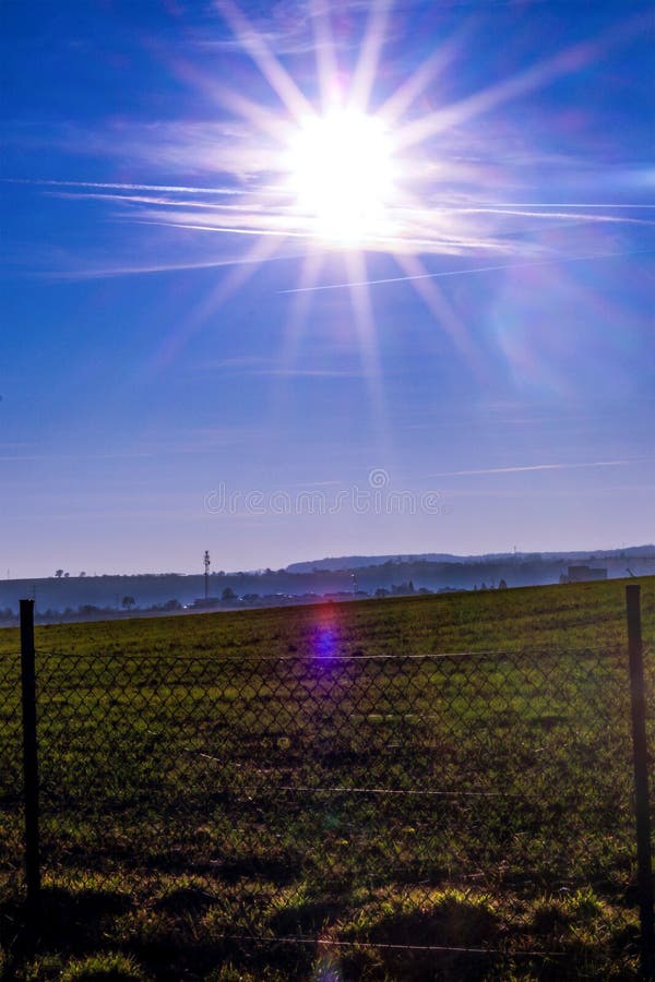 Sunset in the blue sky over the field. royalty free stock photos Sunset in the blue sky over the field. royalty free stock photos