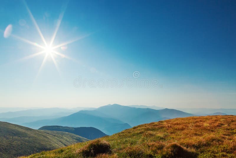 Bright sun in mountains stock image. Image of clouds - 58042023