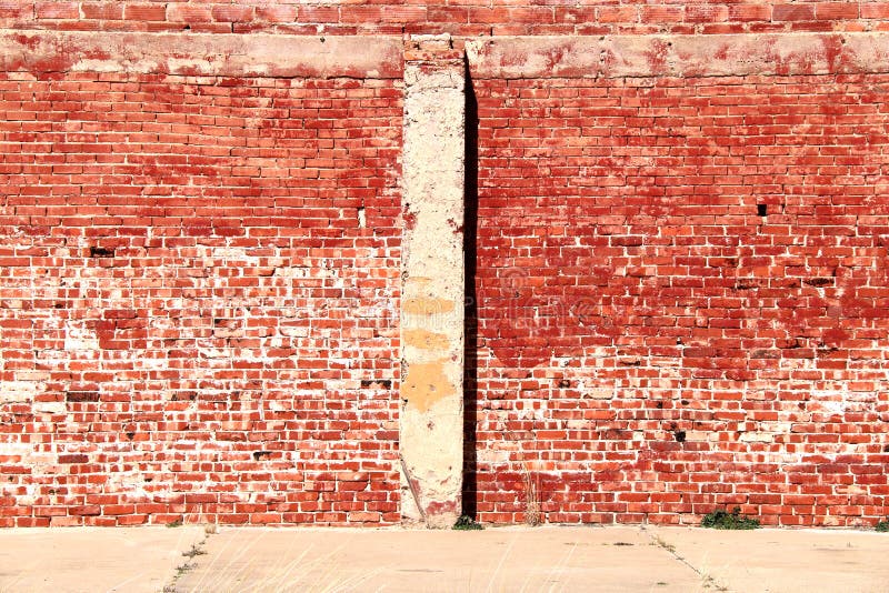 Bright sunlit vintage red brick building wall stock images