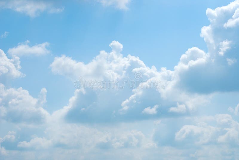 Bright sunny clouds against blue sky