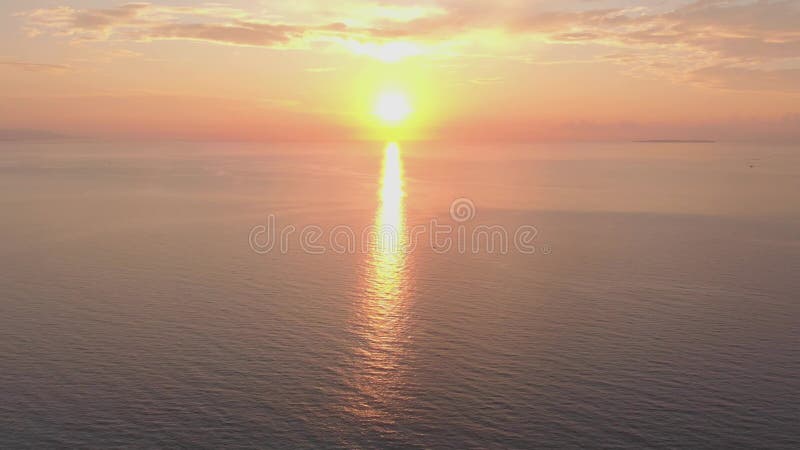 Bright sunrise over the ocean. Rising sun over the sea