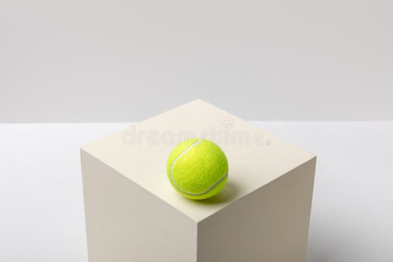 Bright Yellow Tennis Ball on Cube Stock Photo Image of backdrop, activity 174545086