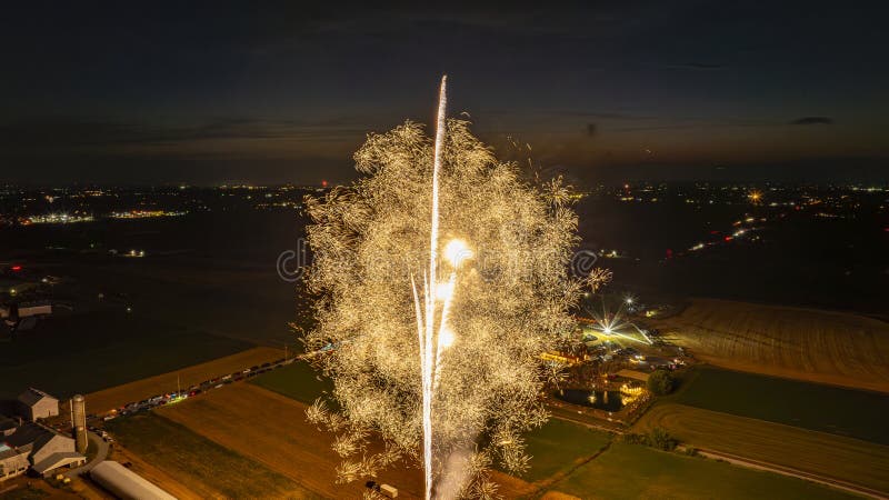 Brilliant Golden Fireworks Erupt In The Night Sky, Creating A Dazzling Display stock image