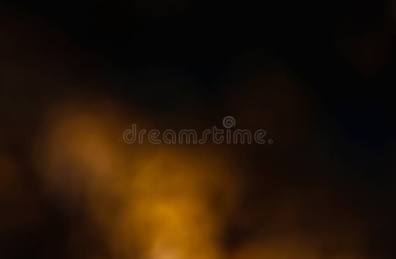 Brillo amarillo en un fondo oscuro. fondo borroso abstracto fotografía de archivo libre de regalías
