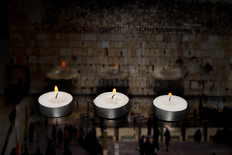 Burning candles on blurred semi transparent Jerusalem Western Wall background. Photo for Israel Memorial Day, Holocaust Remembrance Day or Memorial Day for Fallen Soldiers and Victims of Hostile Acts. Burning candles on blurred semi transparent Jerusalem Western Wall background. Photo for Israel Memorial Day, Holocaust Remembrance Day or Memorial Day for Fallen Soldiers and Victims of Hostile Acts