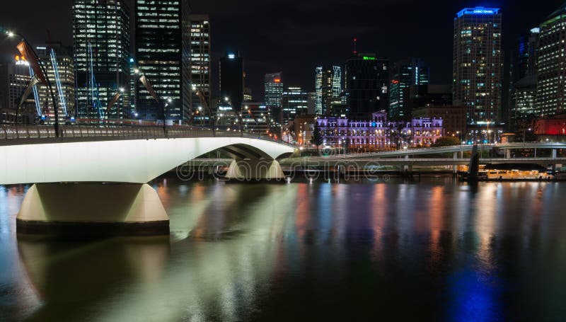 Brisbane Victoria Bridge iluminated against dark and city building lights royalty free stock photo Brisbane Victoria Bridge iluminated against dark and city building lights royalty free stock photo