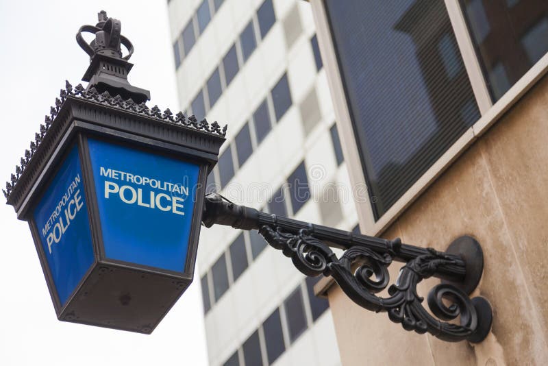 Traditional British Metropolitan Police lamp sign outside police station, London, England. Traditional British Metropolitan Police lamp sign outside police station, London, England