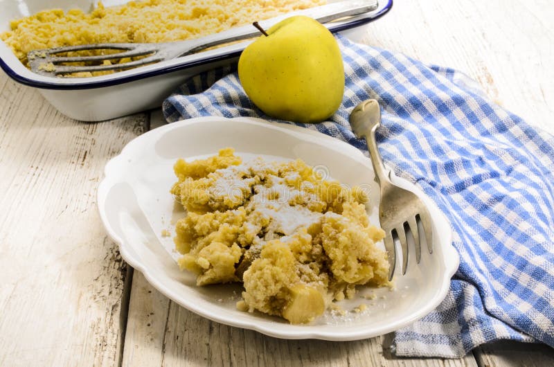 British apple crumble, freshly baked, served with powdered sugar royalty free stock photos