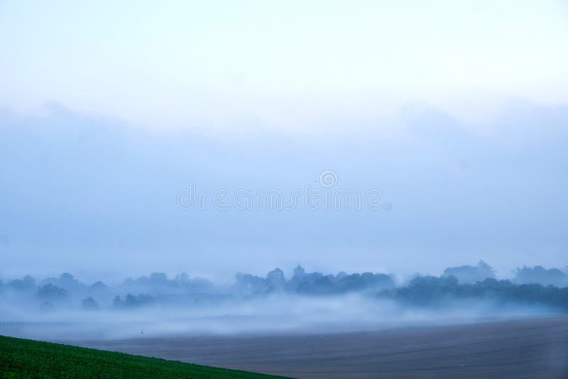 Early morning mist over english village