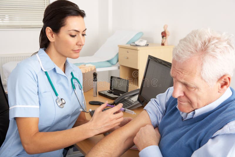British Nurse Giving Injection To Senior Man Stock Photo Image of
