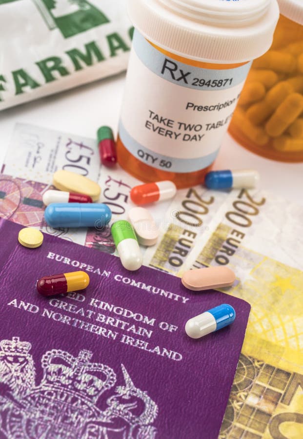 British passport along with several bottles of medicines, concept of medical increase in the crisis of the brexit, conceptual imag royalty free stock image British passport along with several bottles of medicines, concept of medical increase in the crisis of the brexit, conceptual imag royalty free stock image