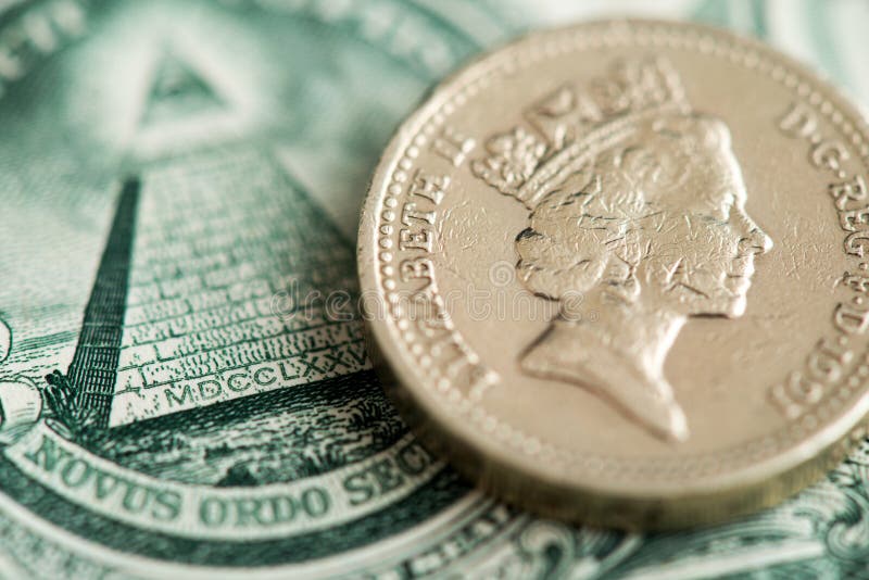 British Sterling Pound coin and US one Dollar banknotes. royalty free stock photo British Sterling Pound coin and US one Dollar banknotes. royalty free stock photo