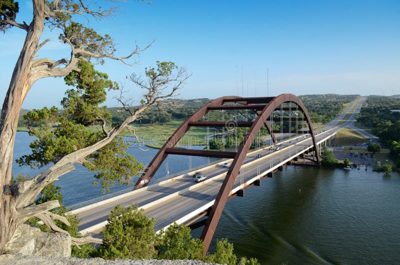 A shot of the Austin 360 Bridge on a clear calm day. This is a very pretty picture of the bridge and a great symbol of Austin, Texas. A shot of the Austin 360 Bridge on a clear calm day. This is a very pretty picture of the bridge and a great symbol of Austin, Texas.