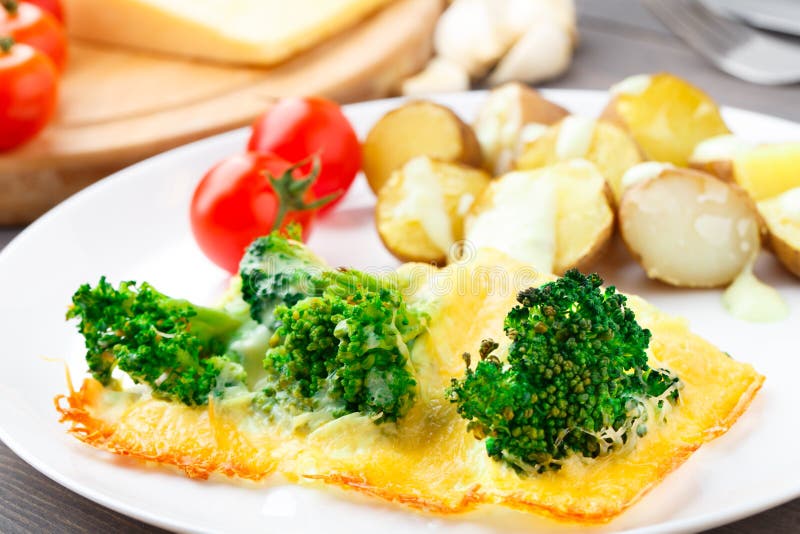 Broccoli Gratin with Cheese and Baked Potato Stock Photo Image of