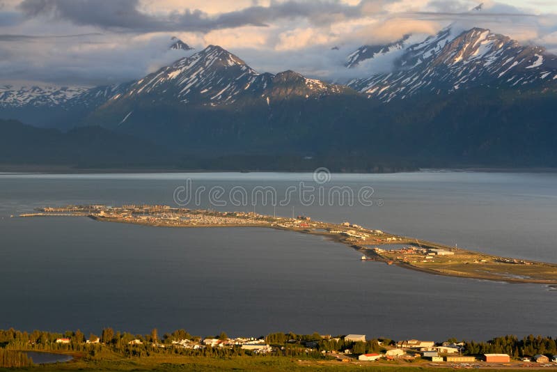 A beautiful view of Homer Alaska, the Kenai Mountains, Kachemak Bay and the world famous Homer Spit from the overlook on East End Road in Homer, Alaska. A common summer cruise ship port of call, located on the very end of the Kenai Peninsula and part of the Pacific Ocean Ring of Fire, Homer is famous for commercial and recreational fishing, particularly halibut, outdoor recreation opportunities, and its eclectic artist vibe is popular with both Alaskans and tourists alike. A beautiful view of Homer Alaska, the Kenai Mountains, Kachemak Bay and the world famous Homer Spit from the overlook on East End Road in Homer, Alaska. A common summer cruise ship port of call, located on the very end of the Kenai Peninsula and part of the Pacific Ocean Ring of Fire, Homer is famous for commercial and recreational fishing, particularly halibut, outdoor recreation opportunities, and its eclectic artist vibe is popular with both Alaskans and tourists alike.