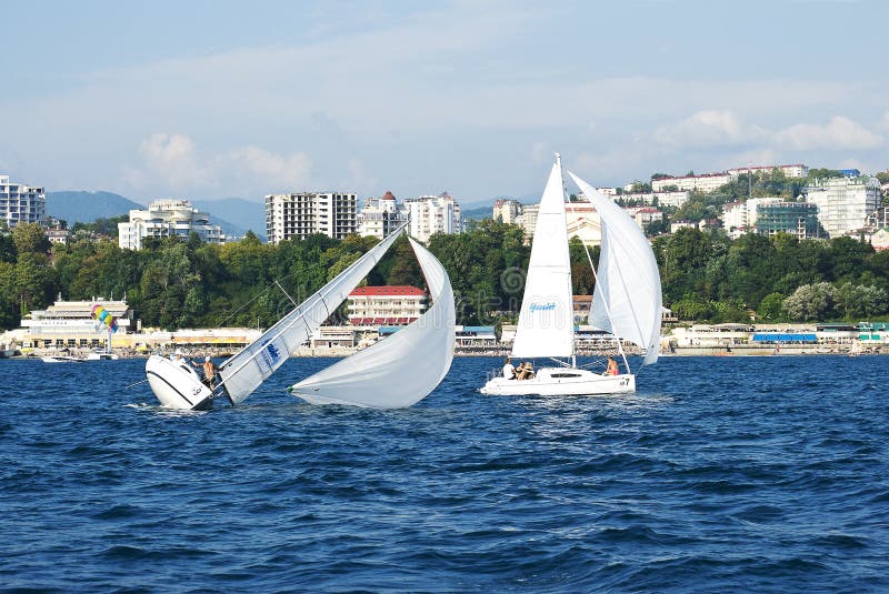 Broching yachts sailing along the coast of Sochi
