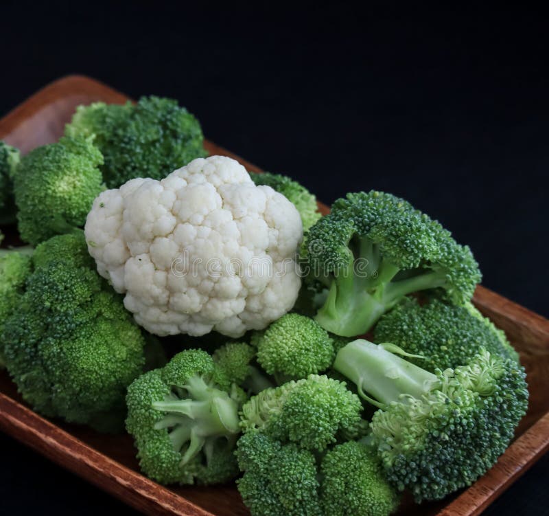Brocolli and 1 Cauliflower Floret in a Wooden Bowl Stock Photo - Image ...