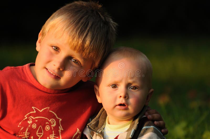 Portrait of two brothers in embracement showing their fraternity and love. Portrait of two brothers in embracement showing their fraternity and love