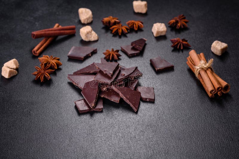Broken Black Chocolate Pieces with Star Anise and Cinnamon Stock Image