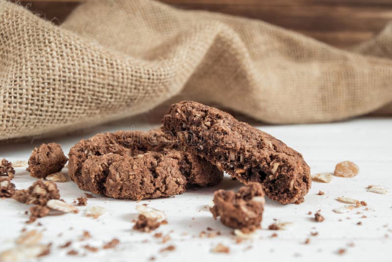 Broken chocolate chip cookie on the table stock image Broken chocolate chip cookie on the table stock image