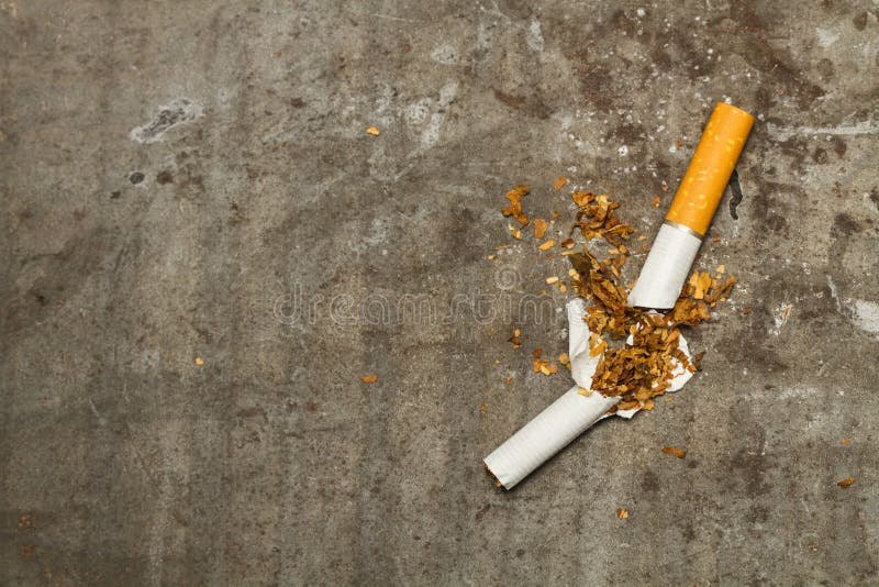 A Broken Cigarette on a Rusty Metal Table Stock Photo Image of close