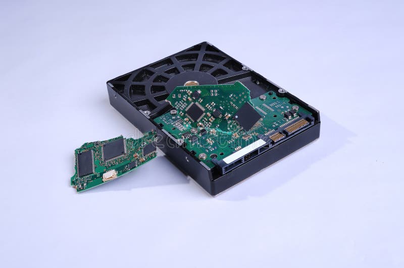 Broken computer hard drive at a white background stock photo Broken computer hard drive at a white background stock photo