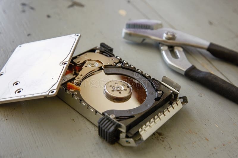 Broken and Destroyed Hard Drive Disk on Wooden Table Stock Photo Image of hardware, cylinder