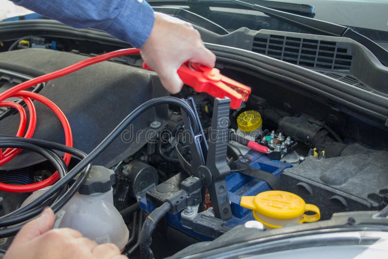 Broken Down Car with Low Battery. Starting with Cables Stock Image