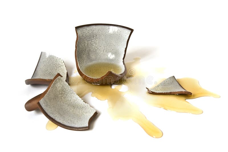 Broken-down cup of tea on white background