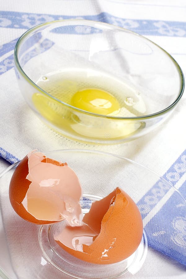 Broken egg in a glass cup stock photo. Image of food 13214212