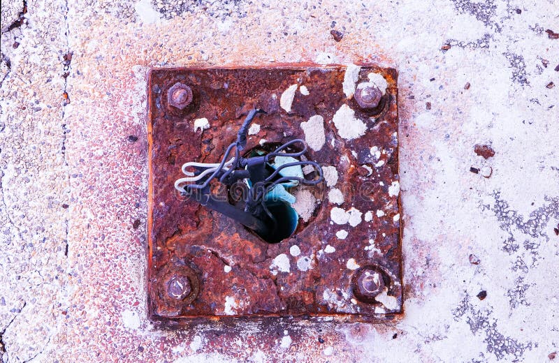 Broken extension for old cable wire on cement concrete ground steel plate rusty. Concept not safety. Extremely dangerous. Electrical extension power cord damaged, wrapped in electrical tape. Damaged extension cord stock images, royalty-free photos and pictures