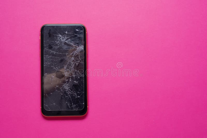 Broken glass mobile phone screen on a pink background. royalty free stock photo Broken glass mobile phone screen on a pink background. royalty free stock photo