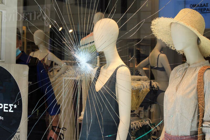 Broken Glass Of Store Window At Ermou Street, In The Commercial Center ...