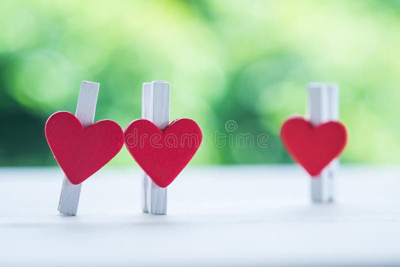 Blank Pink Sticky Notes Sticked On White Wall In Heart Shape Stock