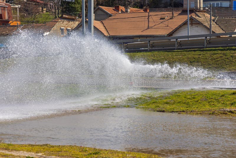 Broken Hydrant Spraying Water royalty free stock image