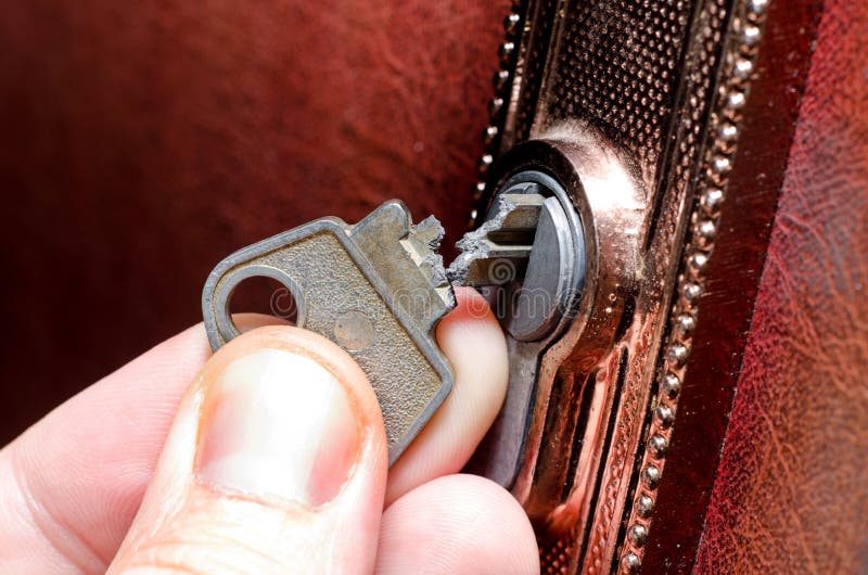 The broken key in the lock stock image. Image of object 140908783