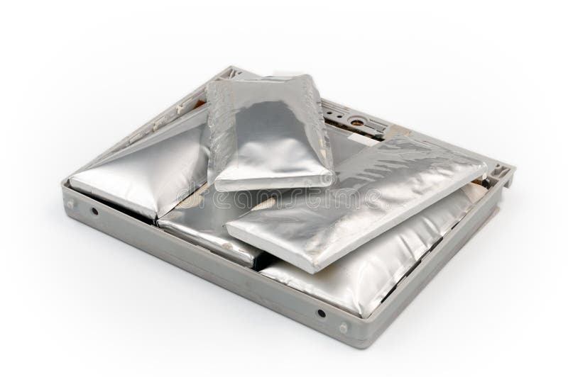 Broken lithium-ion swollen battery pack from laptop isolated on white background. Deep focus royalty free stock photo