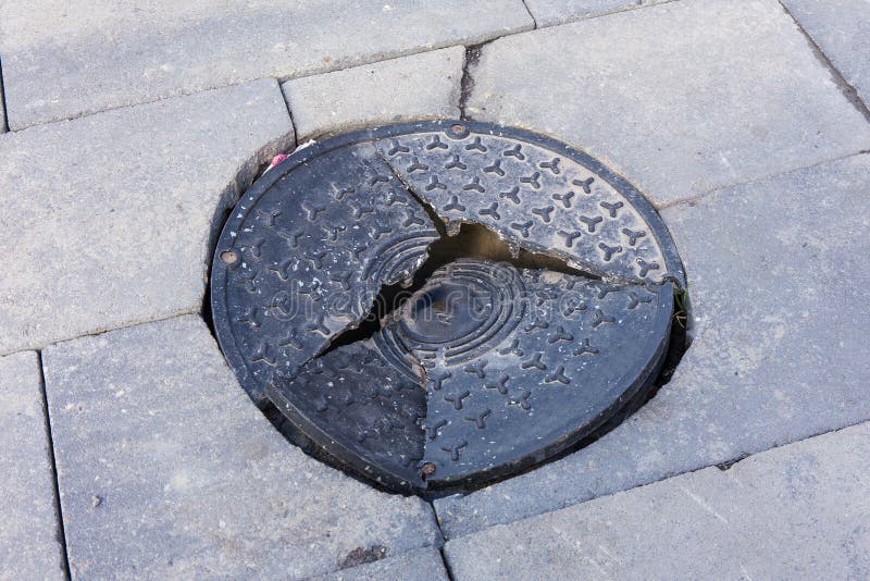 Broken manhole cover stock photo. Image of black, broken 70455406