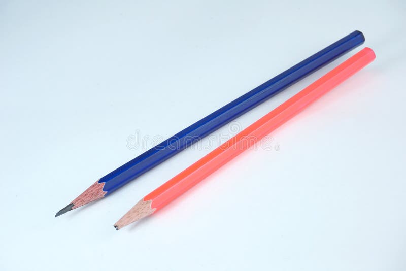 A broken pencil and a sharpened pencil on white background stock images A broken pencil and a sharpened pencil on white background stock images