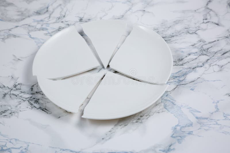 Broken Plate or Broken Glass on the on the Floor in the Kitchen the