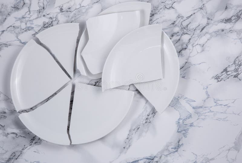 Broken Plate or Broken Glass on the on the Floor in the Kitchen the